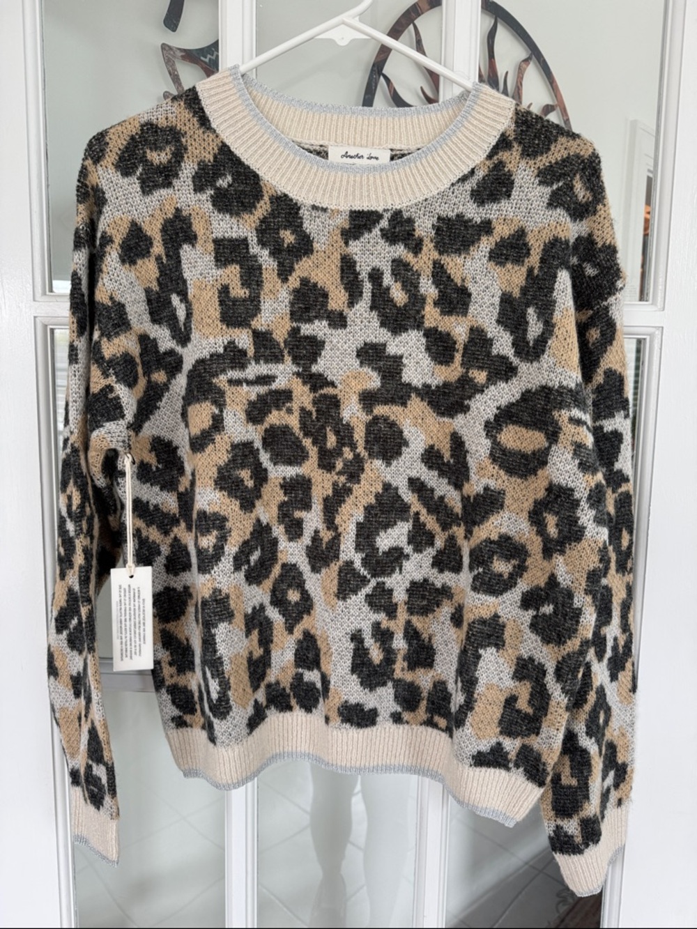 Another Love NWT leopard print sweater w/silver metallic edging, size XS relaxed